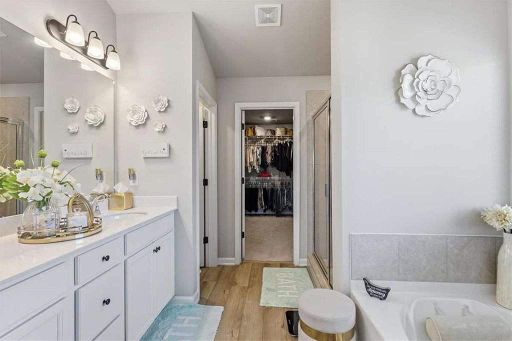 1171 Bodega Loop Locust Grove, GA 30248 - Photo 28 of 57 a bathroom with a sink a toilet and shower