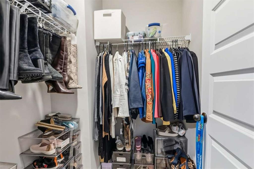 1171 Bodega Loop Locust Grove, GA 30248 - Photo 35 of 57 a view of walk in closet with clothes