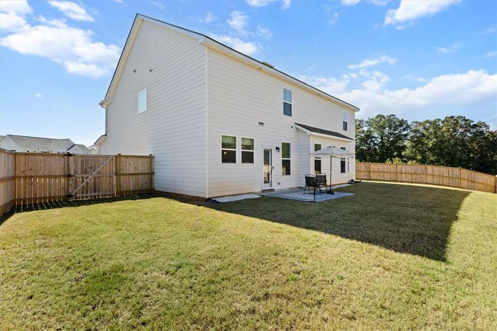 1171 Bodega Loop Locust Grove, GA 30248 - Photo 44 of 57 a view of a backyard of the house