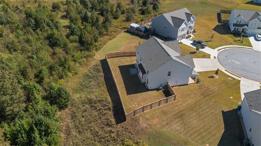 1171 Bodega Loop Locust Grove, GA 30248 - Photo 47 of 57 an aerial view of houses with yard