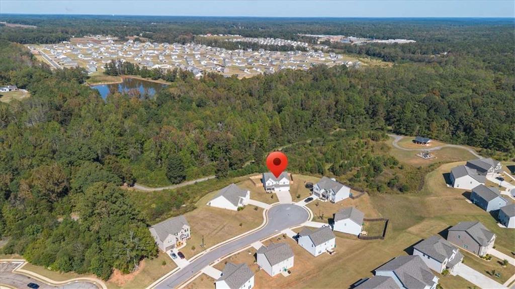 1171 Bodega Loop Locust Grove, GA 30248 - Photo 48 of 57 an aerial view of a house with a yard