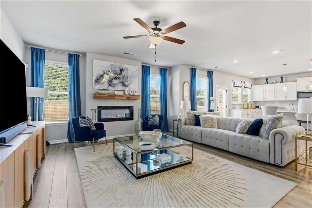 1171 Bodega Loop Locust Grove, GA 30248 - Photo 8 of 57 a living room with furniture and a flat screen tv