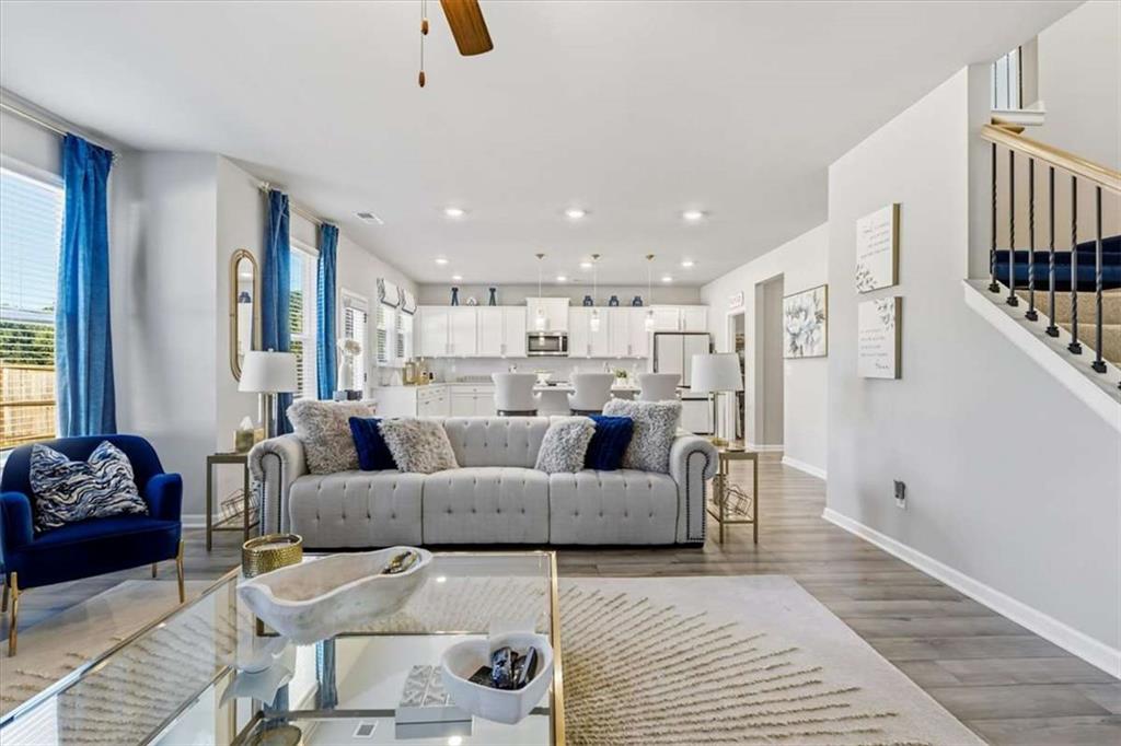1171 Bodega Loop Locust Grove, GA 30248 - Photo 9 of 57 a living room with furniture and a rug