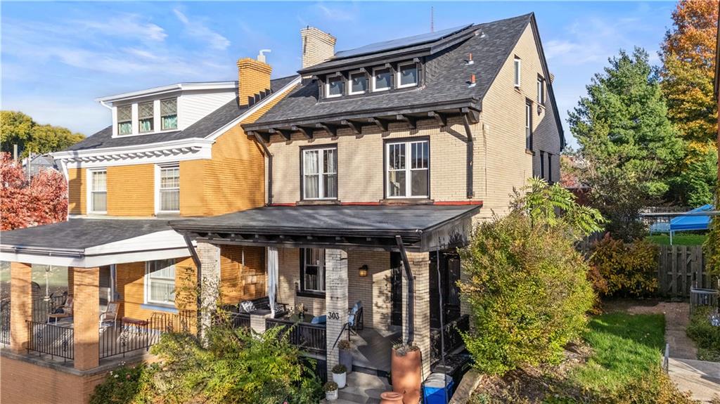 303 Kearsarge Street Pittsburgh, PA 15211 - Photo 1 of 50 a front view of a house with a garden