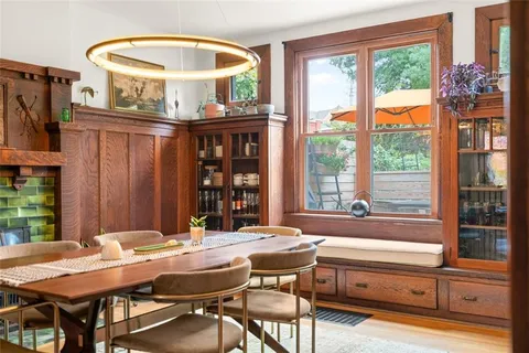 a view of a dining room with furniture window and outside view