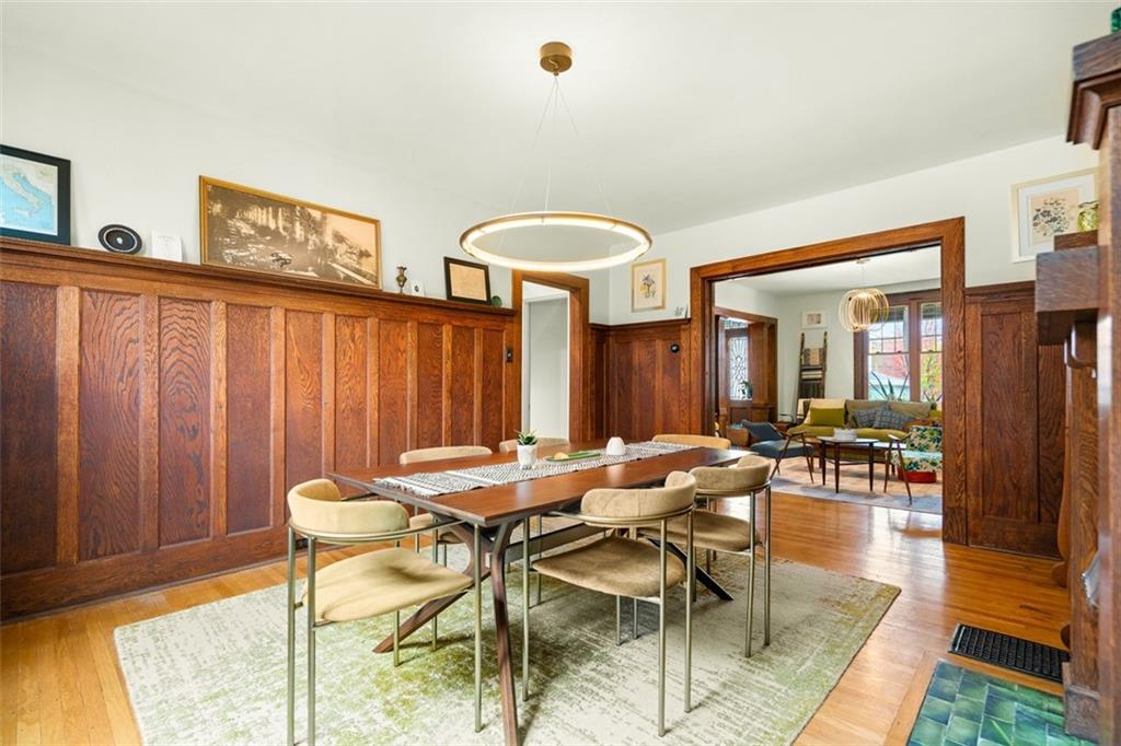 303 Kearsarge Street Pittsburgh, PA 15211 - Photo 13 of 50 a view of a dining room with furniture and chandelier