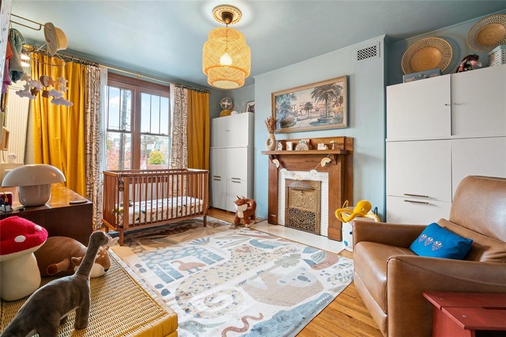 303 Kearsarge Street Pittsburgh, PA 15211 - Photo 21 of 50 a bedroom with furniture and a window