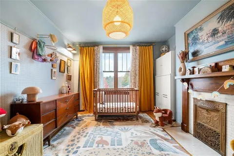 a view of hall way with furniture and a window