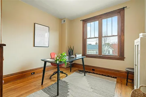 a reading room with furniture and window