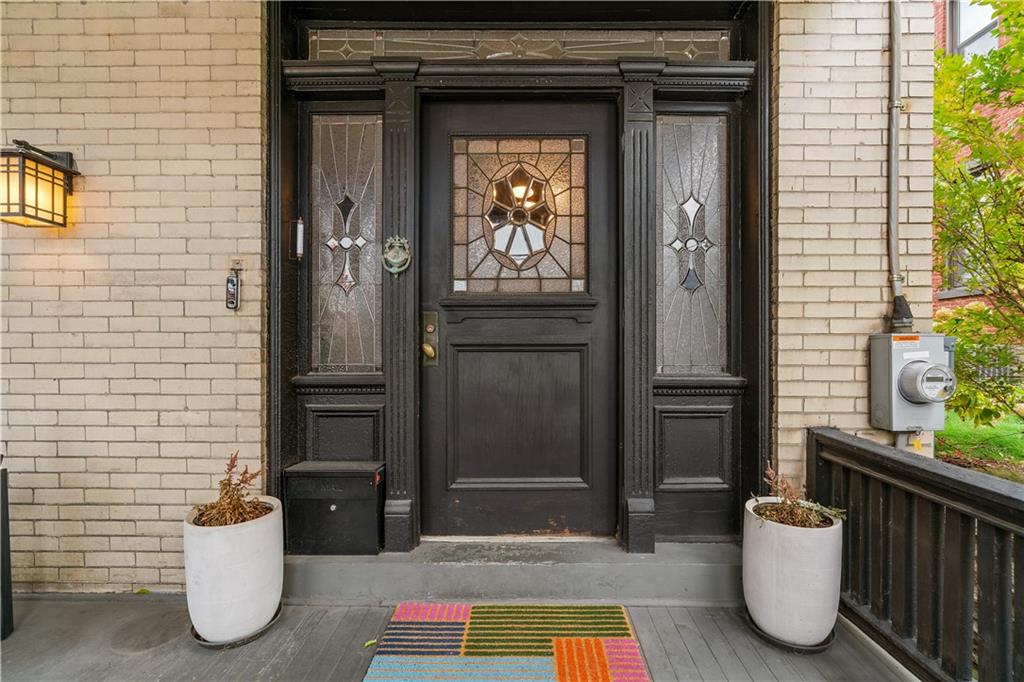 303 Kearsarge Street Pittsburgh, PA 15211 - Photo 3 of 50 a view of an entryway door front of house