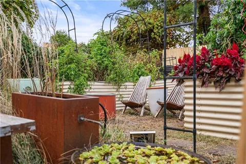 a view of balcony with two chairs and a table
