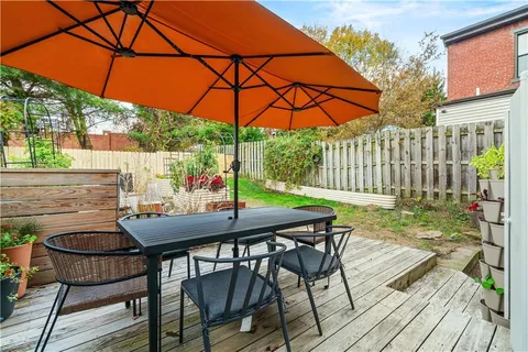 a table and chairs in patio of the house