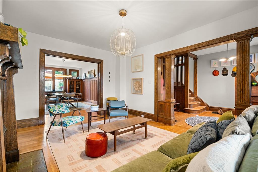 303 Kearsarge Street Pittsburgh, PA 15211 - Photo 6 of 50 a living room with furniture a rug and a chandelier