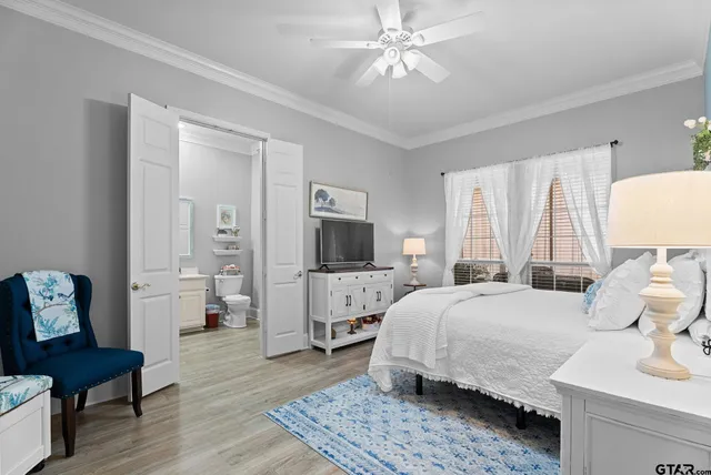 a spacious bedroom with a bed and a couch