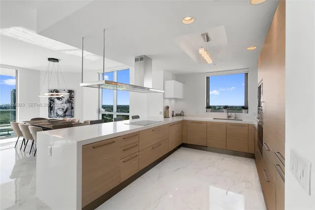a bath tub sitting next to a white sink