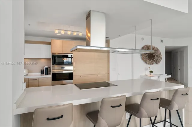 a bedroom with a bed a couch and a window