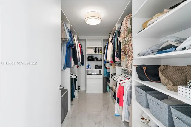 a bedroom with a bed and a table in it