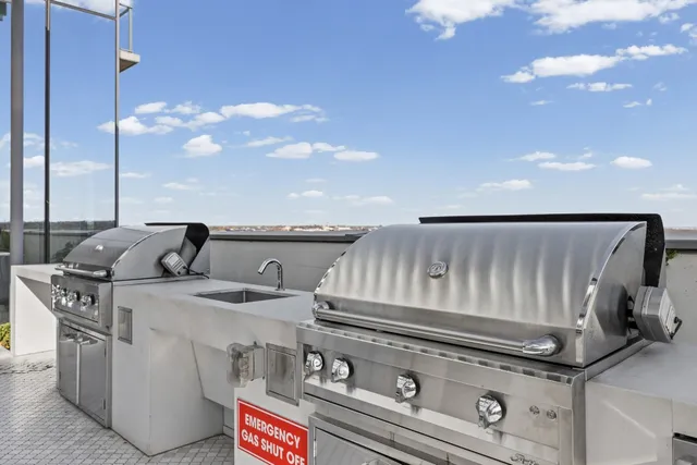 a stove top oven sitting inside of a kitchen