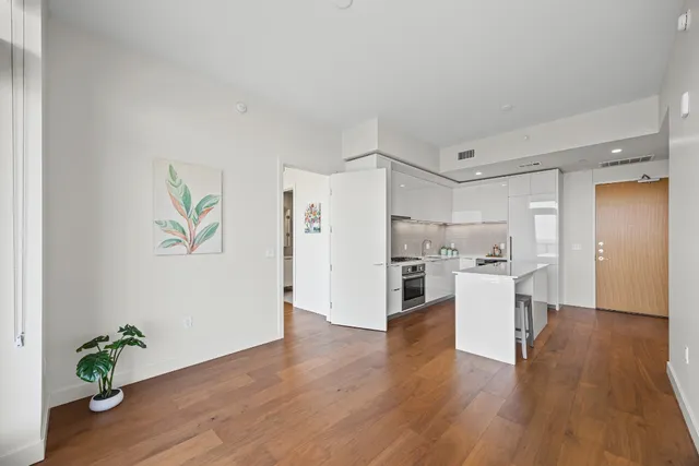 a view of kitchen with furniture and wooden floor