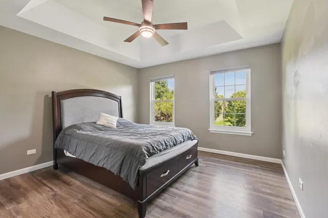 a spacious bedroom with a bed and a window