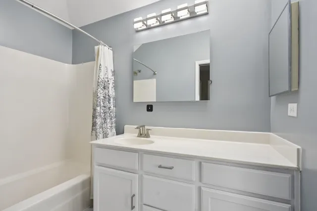 a bathroom with a sink and a bathtub
