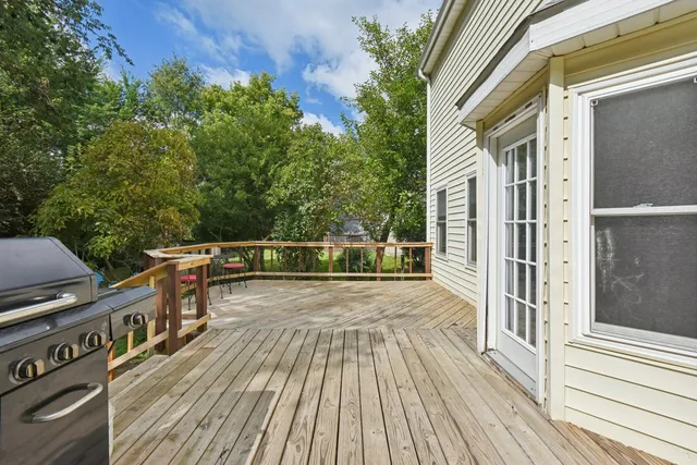 a balcony with wooden floor