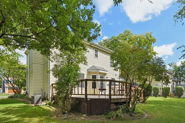 a view of house with a yard