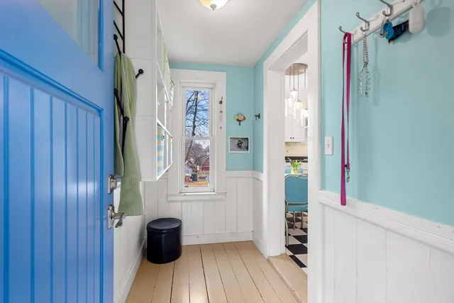 a view of walk in closet with clothes and plants