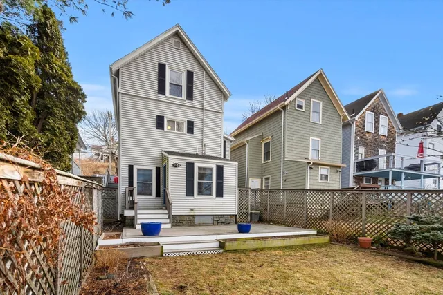 a view of a house with iron fence