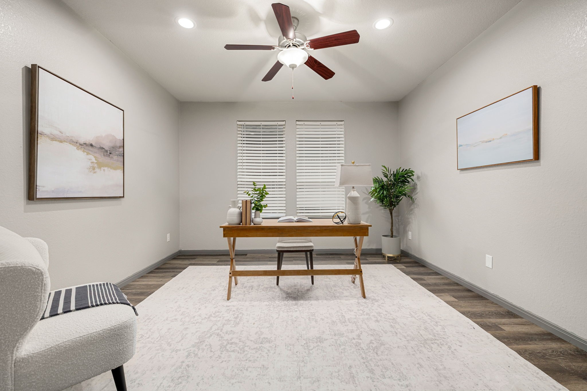 14023 Beaverhead Range Court Conroe, TX 77384 - Photo 14 of 30 Discover the perfect space for productivity and focus in this dedicated home office. This room is ideal for remote work, study, or creative pursuits, offering a quiet retreat within the home. Featuring wood flooring, recessed lighting, ceiling fan, and large windows with blinds. *Virtually Staged