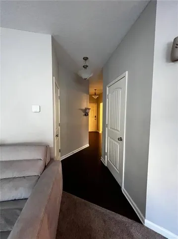 a living room with lots of furniture and a rug