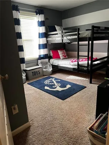 a bathroom with a sink a vanity and toilet