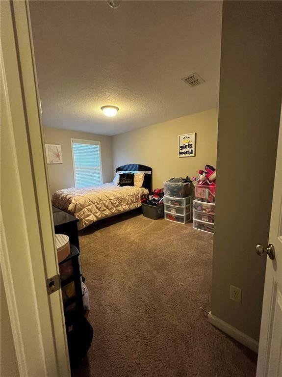 7426 Sorrel Court Columbus, GA 31909 - Photo 23 of 23 a bed room with a bed furniture and a window