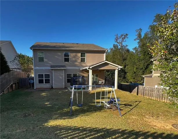 a kitchen with stainless steel appliances kitchen island granite countertop a sink and cabinets