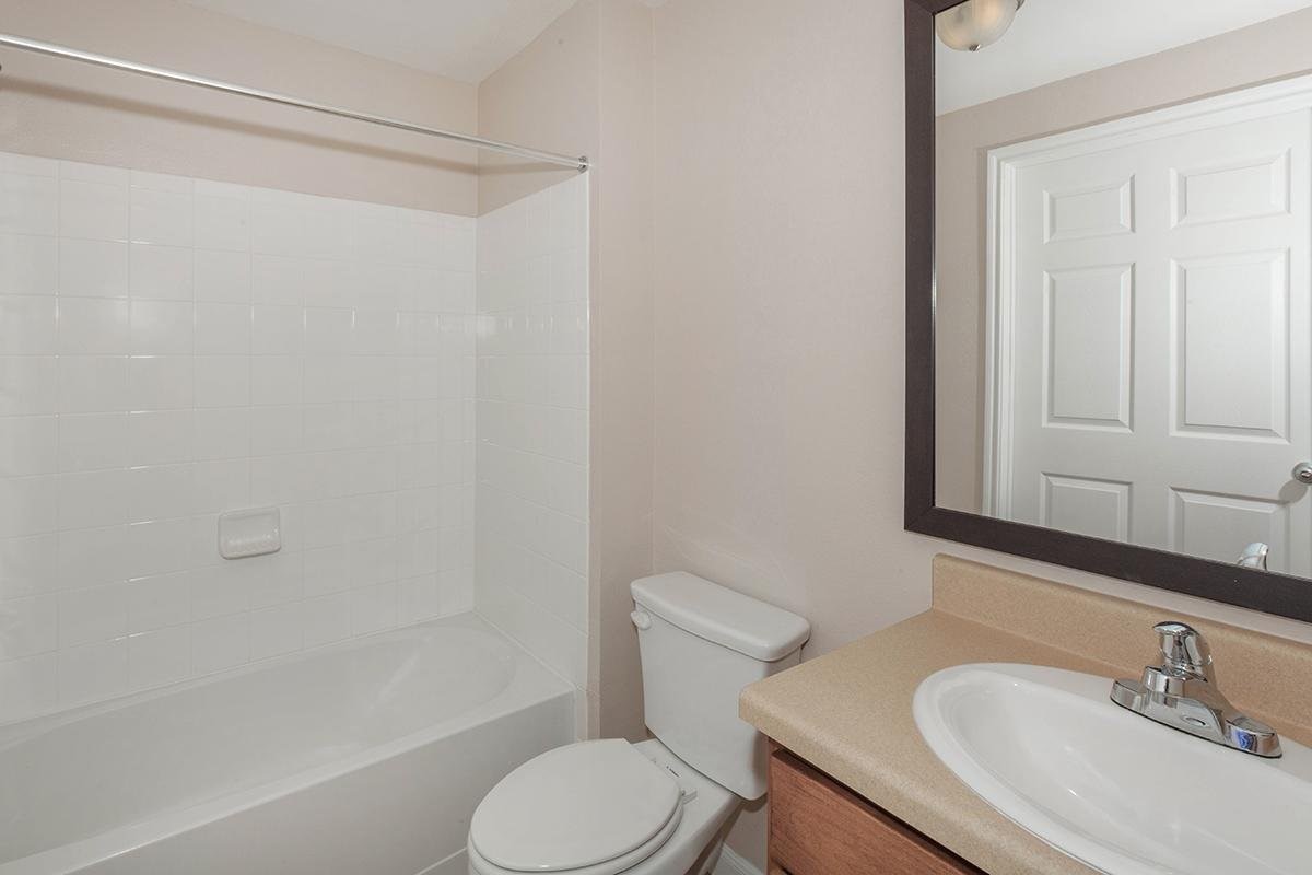 202 Aquero Boulevard Laredo, TX 78045 - Photo 9 of 9 a white toilet sitting next to a bath tub