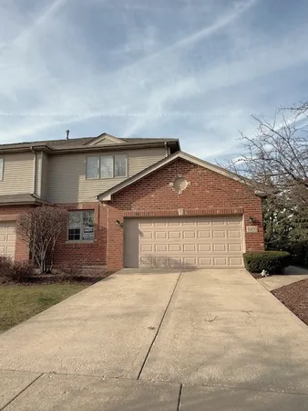 a front view of a house with a garage