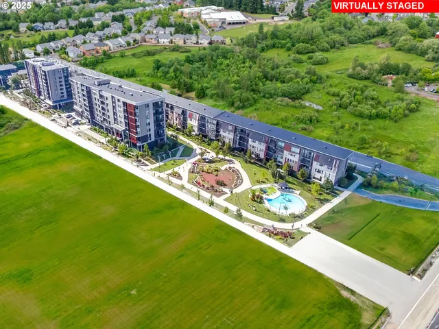 a view of a wooden deck with a yard