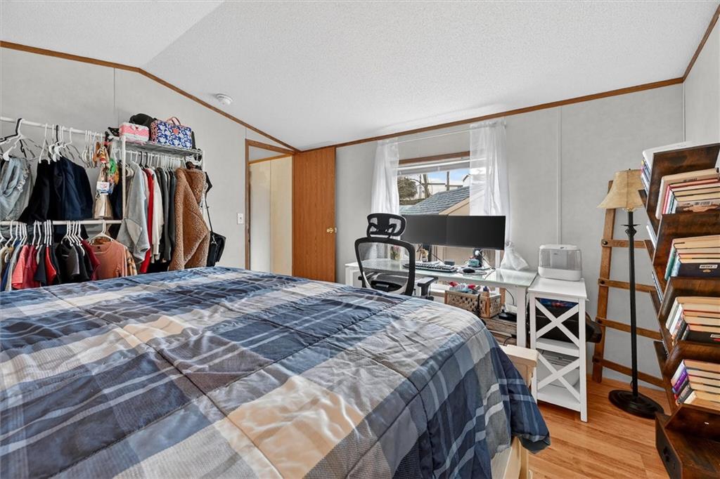 640 Deana Way Rochester, PA 15074 - Photo 11 of 20 a bedroom with a bed and a flat screen tv