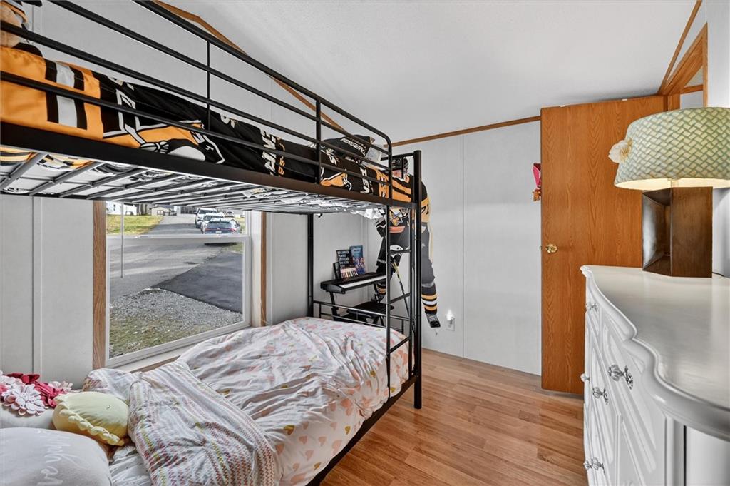 640 Deana Way Rochester, PA 15074 - Photo 14 of 20 a bed sitting in a bedroom next to a window