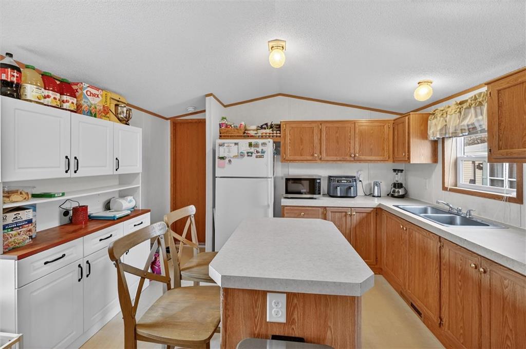 640 Deana Way Rochester, PA 15074 - Photo 5 of 20 a kitchen with stainless steel appliances granite countertop a sink refrigerator and cabinets