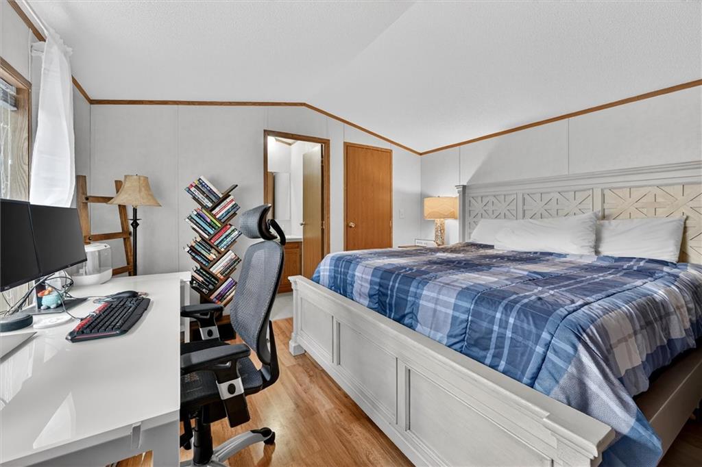 640 Deana Way Rochester, PA 15074 - Photo 9 of 20 a bedroom with a bed and a flat screen tv