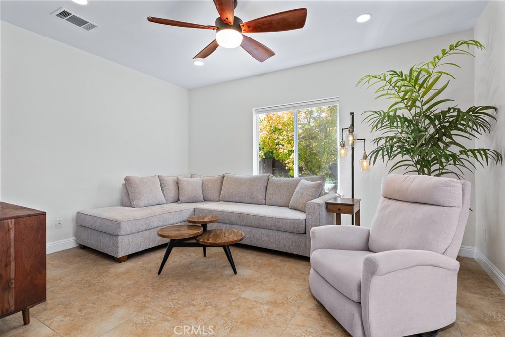 142 Via Camelia Paso Robles, CA 93446 - Photo 13 of 43 a living room with furniture and a large window