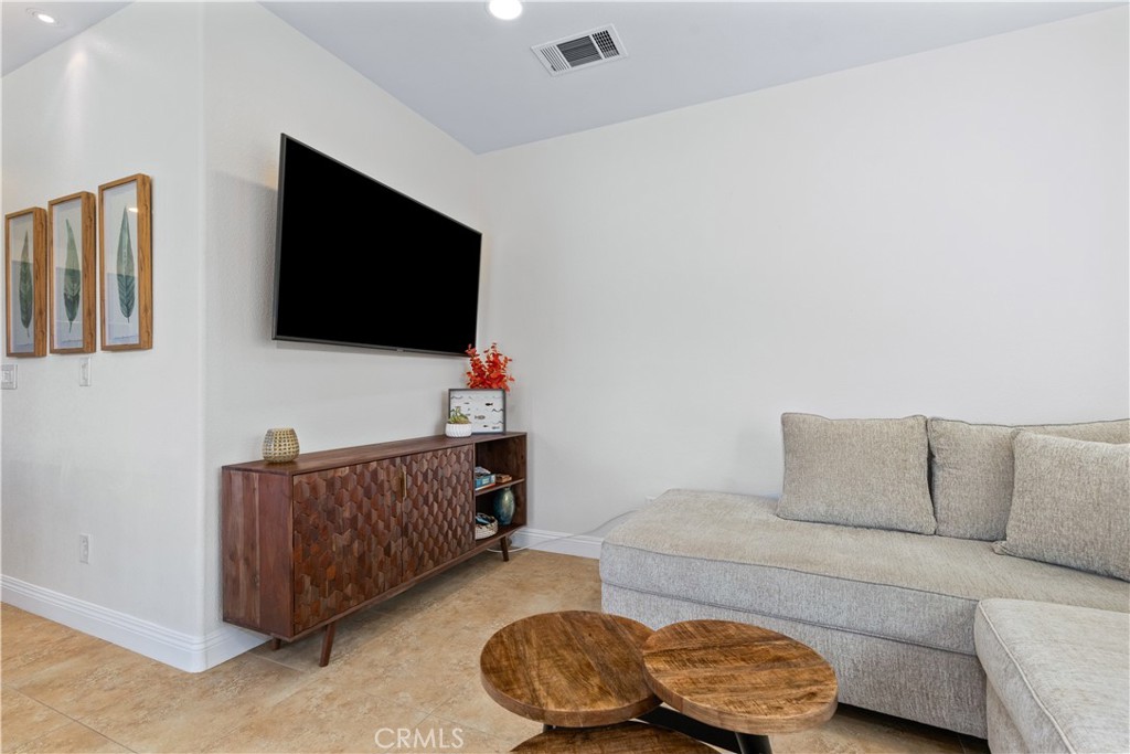 142 Via Camelia Paso Robles, CA 93446 - Photo 14 of 43 a living room with furniture and a flat screen tv