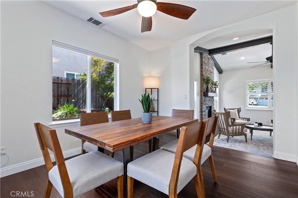 142 Via Camelia Paso Robles, CA 93446 - Photo 15 of 43 a view of a dining room with furniture window and wooden floor