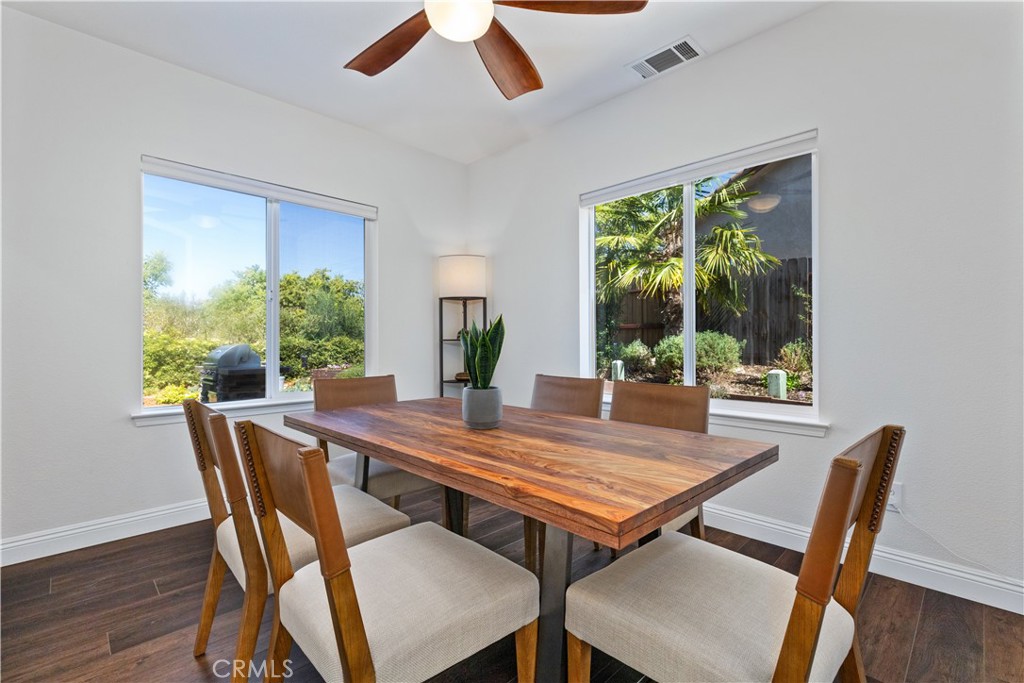 142 Via Camelia Paso Robles, CA 93446 - Photo 16 of 43 a view of a dining room with furniture window and wooden floor