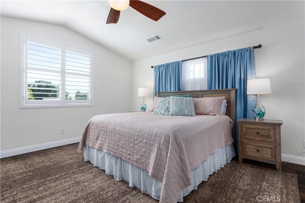 142 Via Camelia Paso Robles, CA 93446 - Photo 17 of 43 a bedroom with a bed dresser and a window