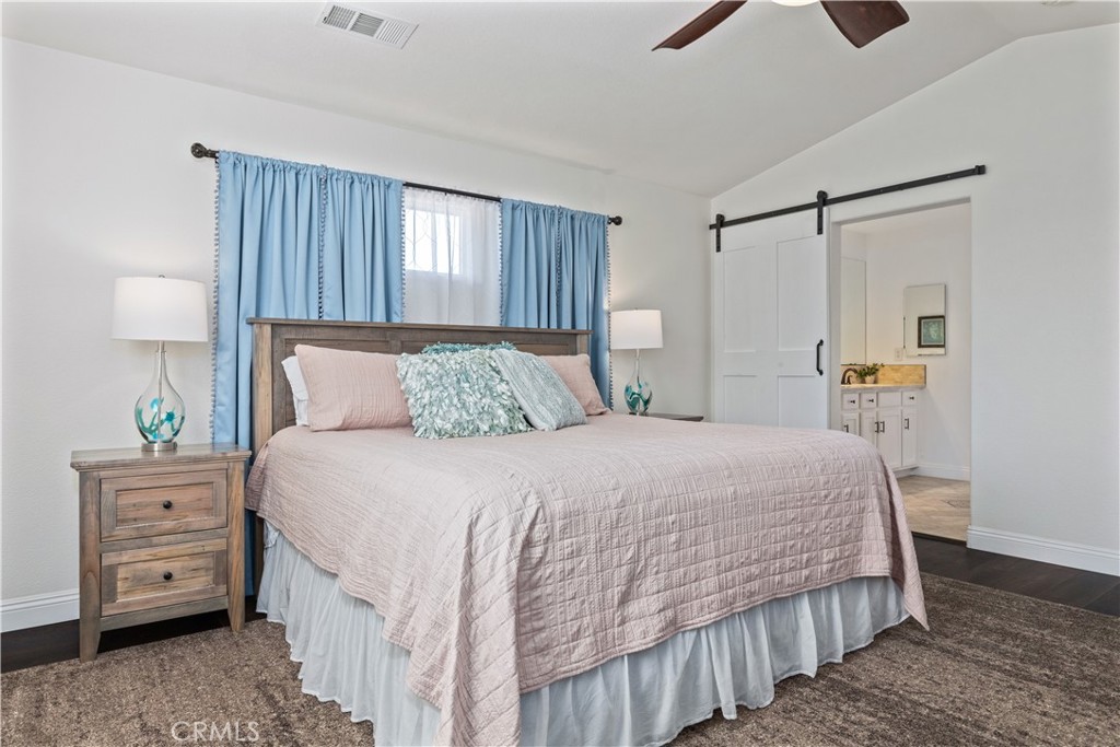 142 Via Camelia Paso Robles, CA 93446 - Photo 19 of 43 a bedroom with a bed a dresser and a window