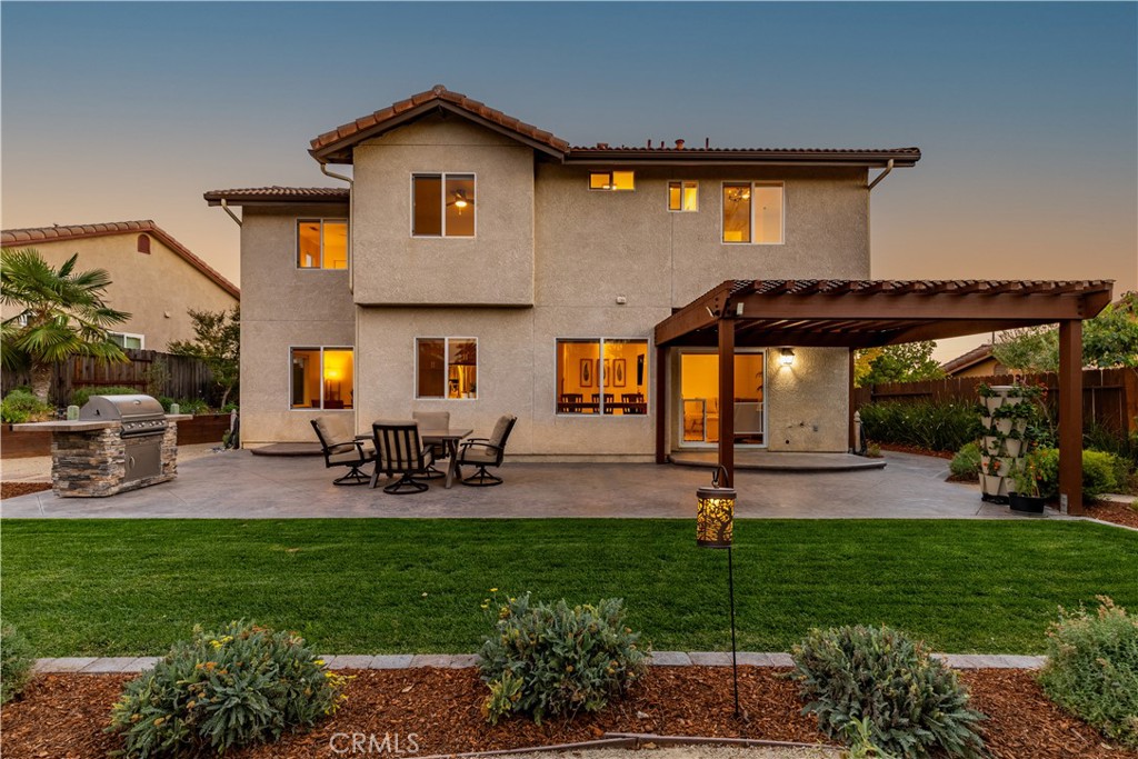 142 Via Camelia Paso Robles, CA 93446 - Photo 31 of 43 a front view of house with a garden and sitting area