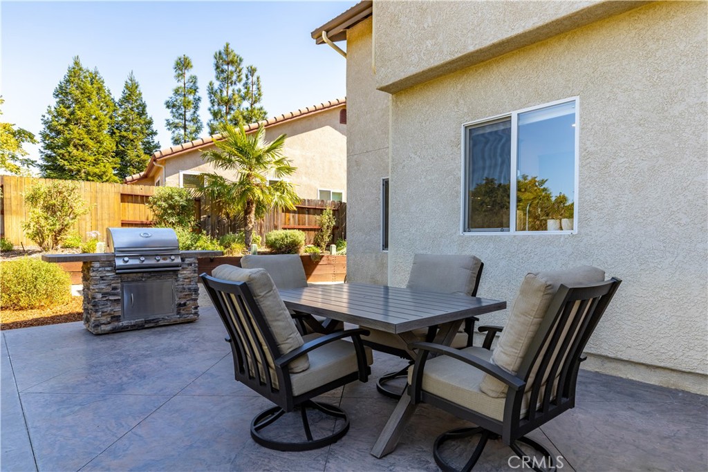 142 Via Camelia Paso Robles, CA 93446 - Photo 32 of 43 a view of a dining room with furniture and a potted plant