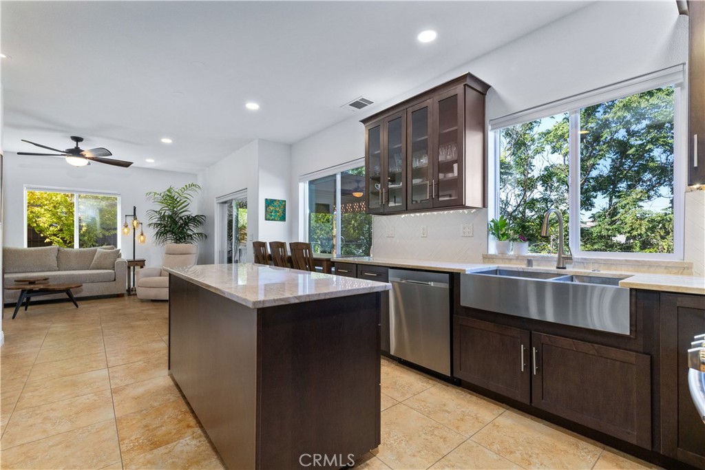 142 Via Camelia Paso Robles, CA 93446 - Photo 7 of 43 a kitchen with kitchen island a large window in it